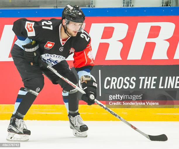 Anders Overmark of Vojens controls the puck during the Champions Hockey League group stage game between SonderjyskE Vojens and HV71 Jonkoping on...