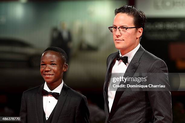 Actor Abraham Attah and director Cary Fukunaga attend the premiere of 'Beasts Of No Nation' during the 72nd Venice Film Festival on September 3, 2015...