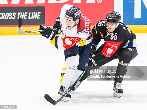 Kristoffer Mohr of Vojens challenges a Jonkoping player during the Champions Hockey League group stage game between SonderjyskE Vojens and HV71...