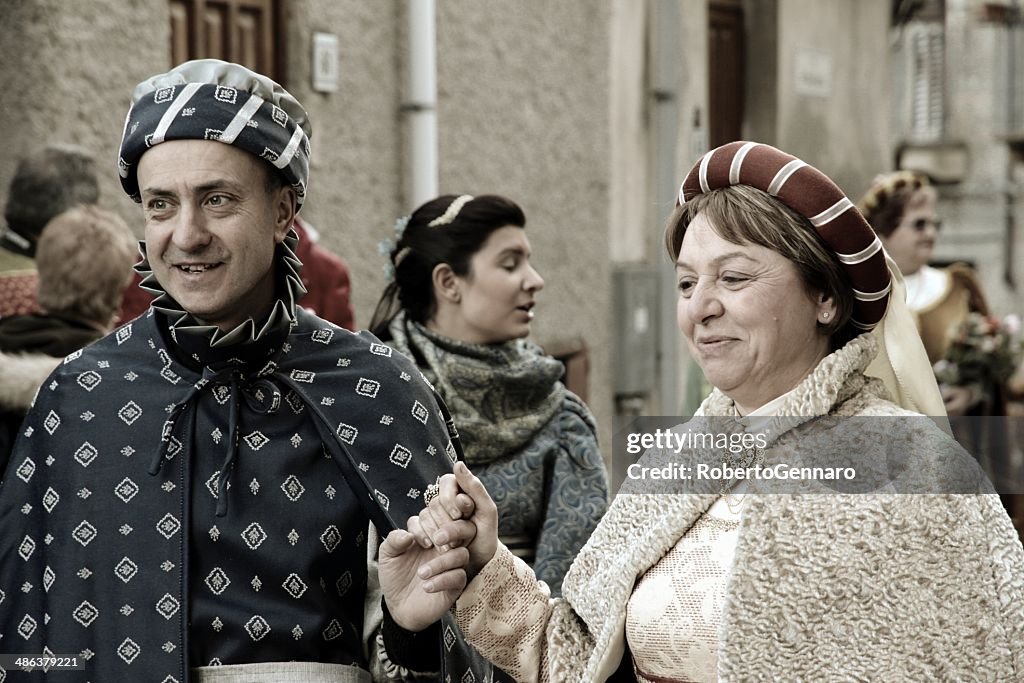 Medieval parade actors couple of courtiers