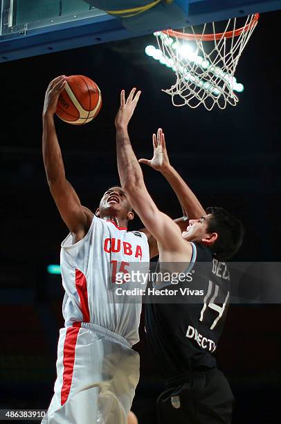 Jasiel Rivero of Cuba goes up against Gabriel Deck of Argentina during a match between Argentina v Cuba as part of the 2015 FIBA Americas...