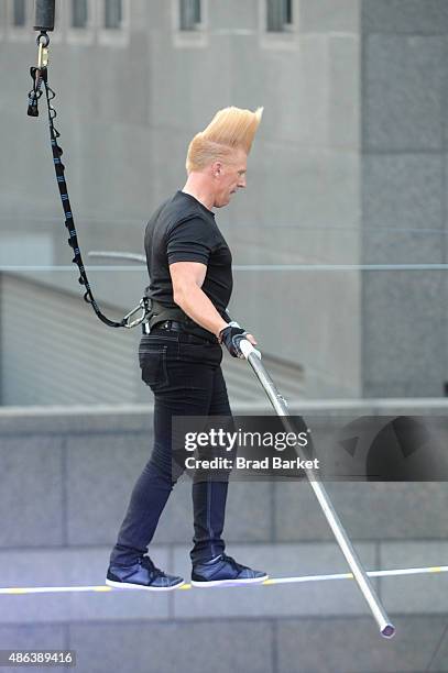 Bello Nock walks the high-wire at the Impractical Jokers 100th Episode Live Punishment Special at the South Street Seaport on September 3, 2015 in...