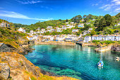 Polperro harbour Cornwall England UK with turquoise sea in HDR