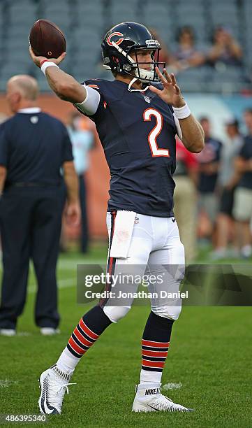 Zac Dysert of the Chicago Bears participates in warm-ups before a preseason game against the Cleveland Browns at Soldier Field on September 3, 2015...