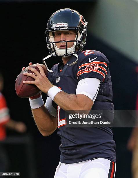 Zac Dysert of the Chicago Bears participates in warm-ups before a preseason game against the Cleveland Browns at Soldier Field on September 3, 2015...