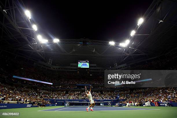 Roger Federer of Switzerland serves to Steve Darcis of Belgium during their Men's Singles Second Round match on Day Four of the 2015 US Open at the...