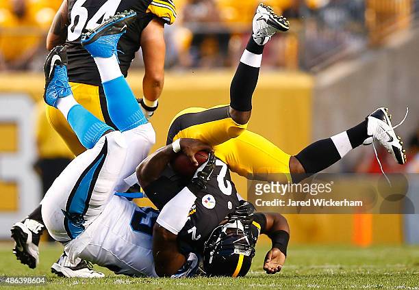 Michael Vick of the Pittsburgh Steelers is tackled by Kawann Short of the Carolina Panthers in the first quarter during the game at Heinz Field on...