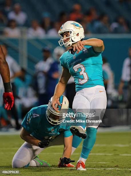 Andrew Franks of the Miami Dolphins kicks a field goal during a preseason game against the Tampa Bay Buccaneers at Sun Life Stadium on September 3,...