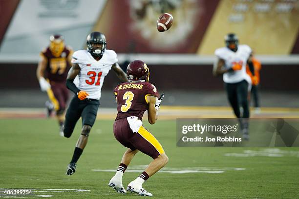 Mark Chapman of the Central Michigan Chippewas makes a 40-yard reception on a trick play in the first half of the game against the Oklahoma State...