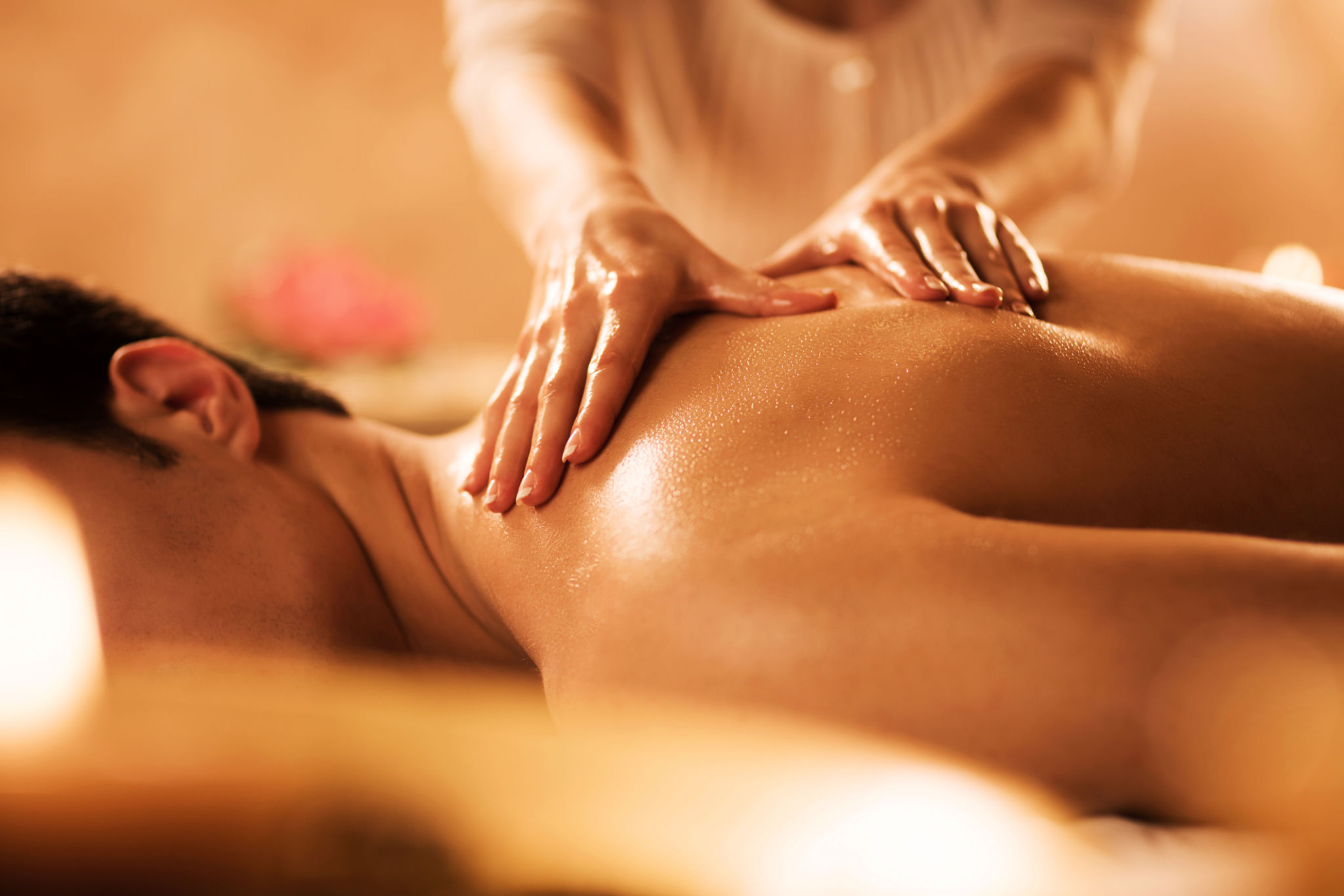 Unrecognizable man receiving massage at the spa. Unrecognizable man receiving massage at the spa.