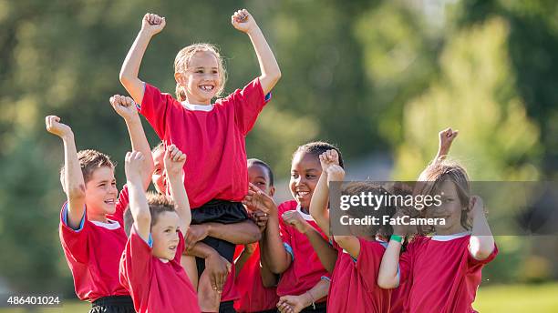 winning the championship game - kid cheering stock pictures, royalty-free photos & images