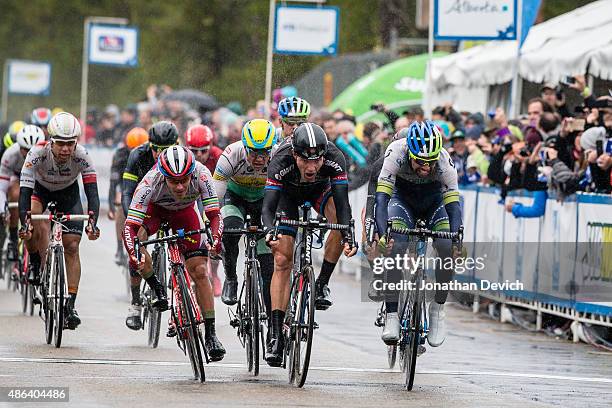 Michael Matthews of the ORICA-GreenEDGE team narrowly wins over Nikias Arndt of Team Giant-Alpecin in second place and Aleksei Tcatevich of Team...