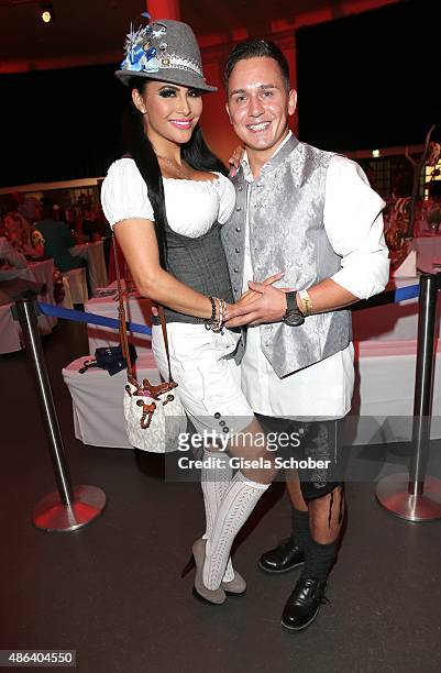 Mia Gray and her boyfriend Oliver Kobs during the Angermaier Trachten-Nacht 2015 at Postpalast in Munich on September 3, 2015 in Munich, Germany.