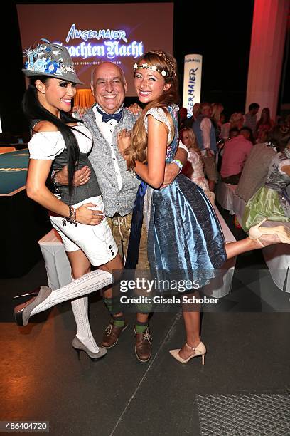 Playmate Mia Gray, Axel Munz, CEO Angermaier Trachten and Jessica Kuehne during the Angermaier Trachten-Nacht 2015 at Postpalast in Munich on...