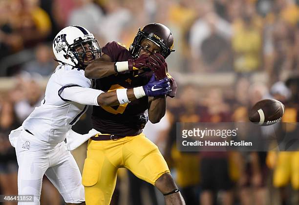 Ranthony Texada of the TCU Horned Frogs breaks up a pass intended for Eric Carter of the Minnesota Golden Gophers during the second quarter of the...