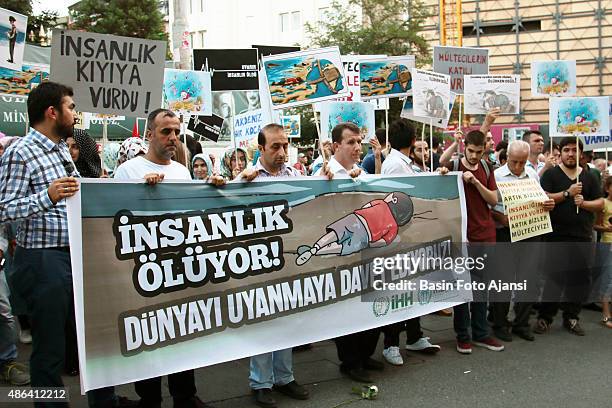 Banner reads: " Mankind is dying... Wake up the World! ". The demonstrators protested against UN's Refugee Policy and EU's on Istiklal street in...