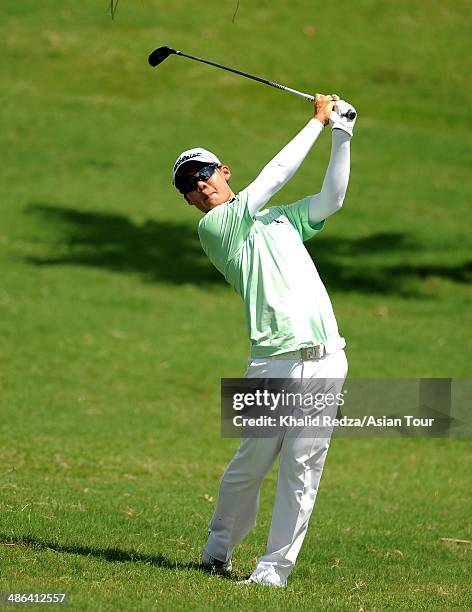 Jazz Janewattananond of Thailand plays a shot during round one of the CIMB Niaga Indonesian Masters at Royale Jakarta Golf Club on April 24, 2014 in...