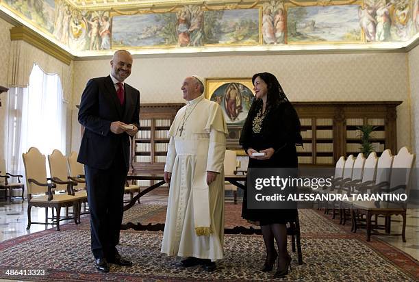 Pope Francis poses for photographers with Prime Minister of Albania, Edi Rama and his wife Linda, during a private audience at the Vatican, on April...