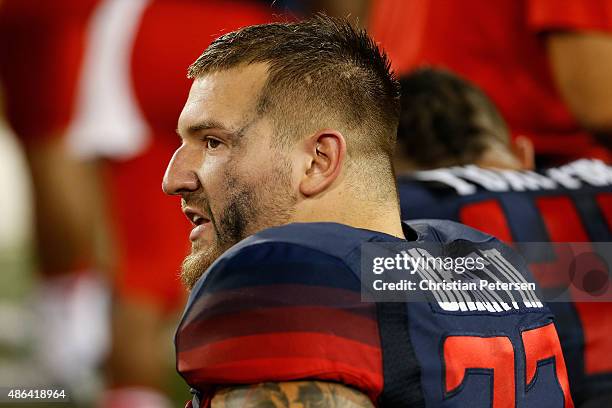 Linebacker Scooby Wright III of the Arizona Wildcats watches from the bench during the second quarter of the college football game against the UTSA...