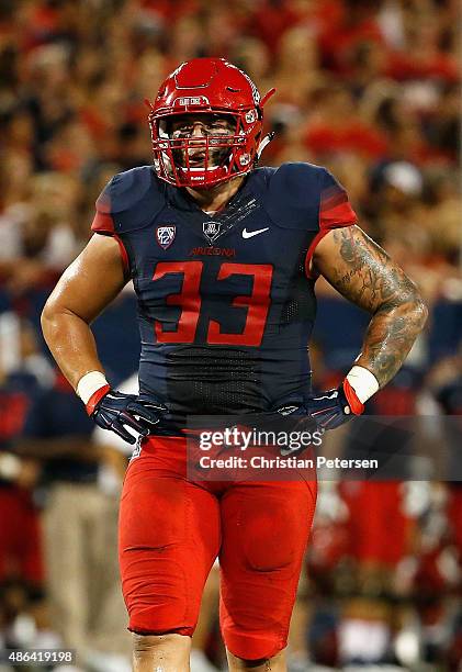 Linebacker Scooby Wright III of the Arizona Wildcats walks on the field during the first quarter of the college football game against the UTSA...