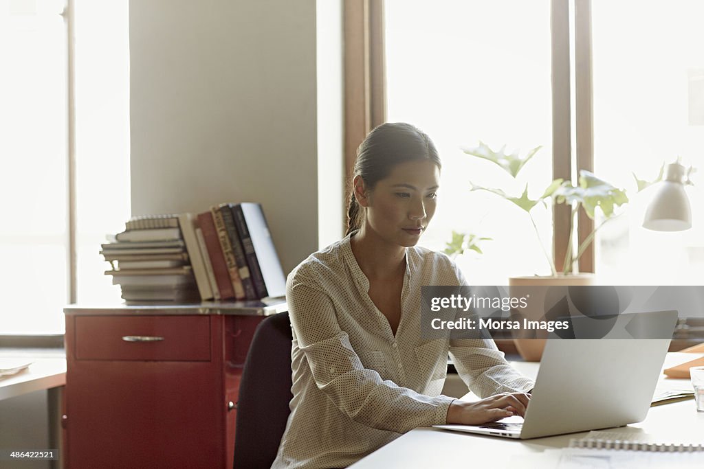 Business woman at working on laptop