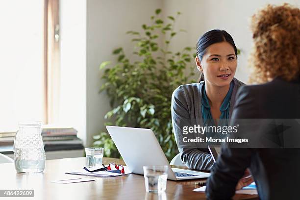 business women discussing project - business meeting stock pictures, royalty-free photos & images