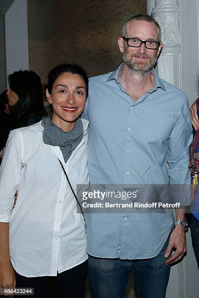 Contemporary Artist Mike Bouchet and his companion Galerist Parisa Kind attend the 'World Press Photo 2015' Exhibition Opening Party, held at Galerie...