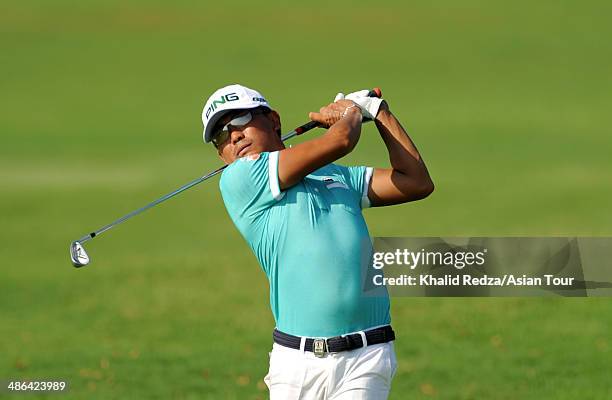 Nicholas Fung of Malaysia in action during round one of the CIMB Niaga Indonesian Masters at Royale Jakarta Golf Club on April 24, 2014 in Jakarta,...