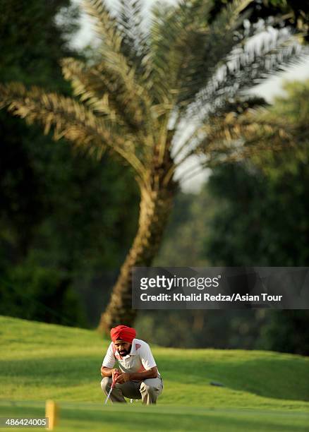 Sujjian Singh of India plays a shot during round one of the CIMB Niaga Indonesian Masters at Royale Jakarta Golf Club on April 24, 2014 in Jakarta,...