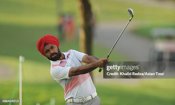 Sujjian Singh of India plays a shot during round one of the CIMB Niaga Indonesian Masters at Royale Jakarta Golf Club on April 24, 2014 in Jakarta,...