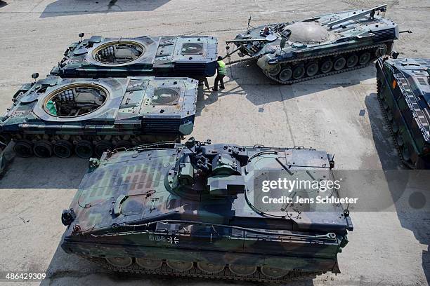 Technician uses a converted Gepard antiaircraft cannon tank to move a other Gepard antiaircraft cannon tank that once belonged to the Bundeswehr at...