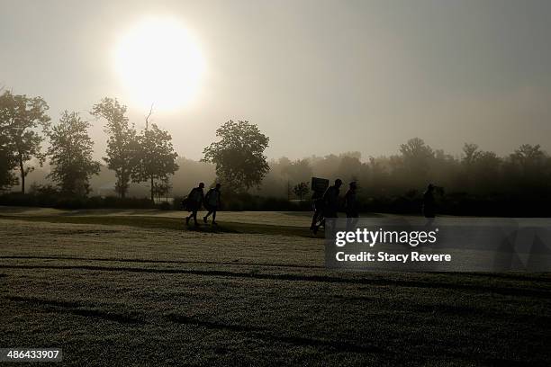 Graham Delaet and his group walk up the 1st fairway during Round One of the Zurich Classic of New Orleans at TPC Louisiana on April 24, 2014 in...