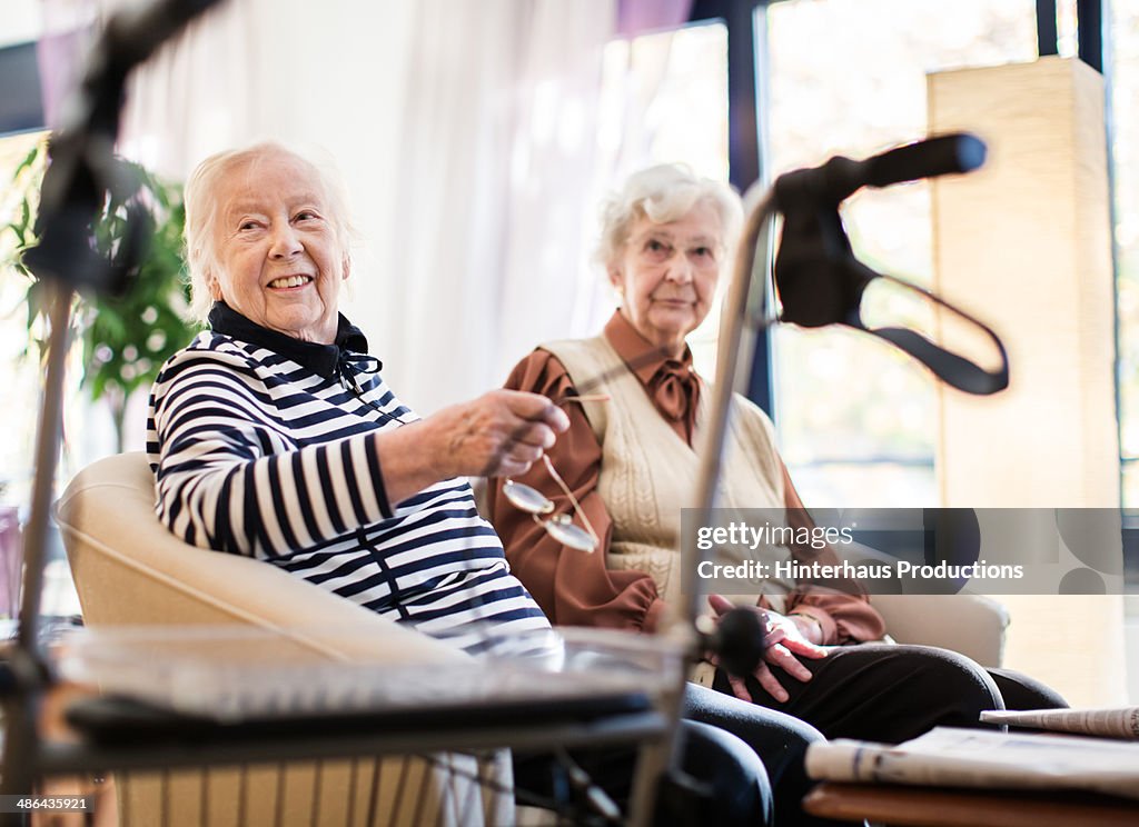 Two Senior Women With Wheeled Walker