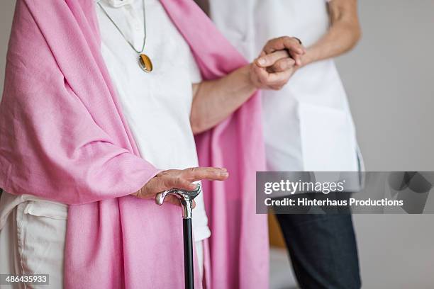 senior woman with cructh get support - bengala acessório imagens e fotografias de stock