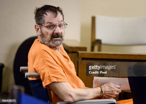 Frazier Glenn Cross, also known as Frazier Glenn Miller, sits with his defense team after being wheeled into a Johnson County courtroom for a...