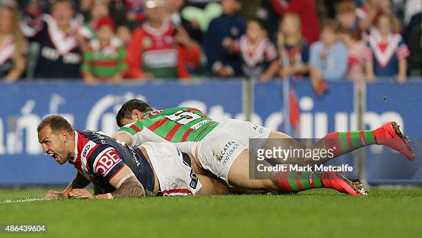 Blake Ferguson of the Roosters scores a try during the round 26 NRL match between the Sydney Roosters and the South Sydney Rabbitohs at Allianz...