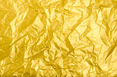Texture and background of wrinkled golden paper