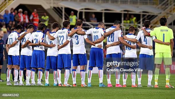 Italy's players observe a minute of silence to pay homage to the deceased of Europe's migrants crisis prior to the UEFA EURO 2016 qualifier between...