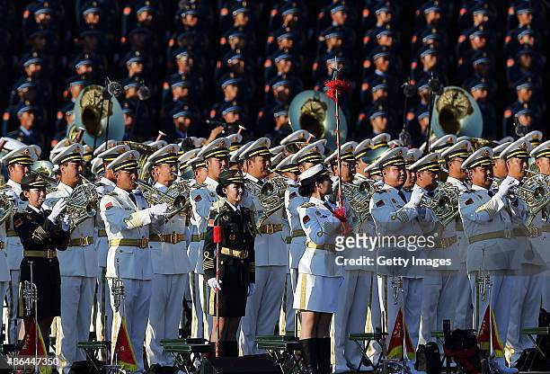 Members of military chorus and joint military band attend the commemoration activities in military parade at Tian'anmen Square on September 3, 2015...