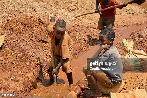 Workers are seen at a gold mine in the Kirekura region of the Cibitoke, Burundi on August 28, 2015. People who work at the gold mines search for gold...
