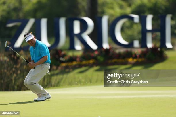 Charlie Wi reacts to a missed birdie putt on the 17th during Round One of the Zurich Classic of New Orleans at TPC Louisiana on April 24, 2014 in...