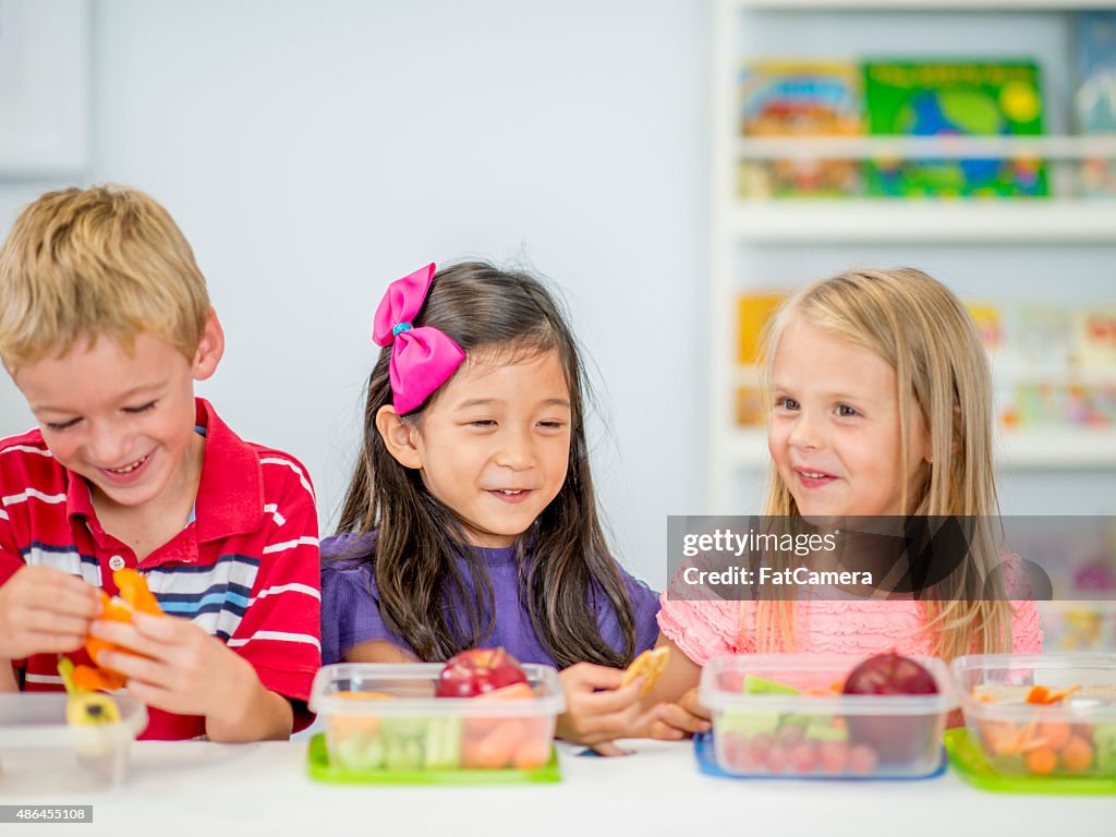 Little Kids Eating Lunch at School