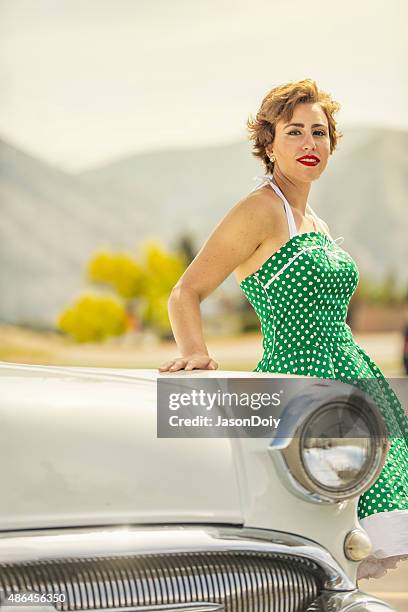 1950s woman leaning on a vintage car - 1950 2015 stock pictures, royalty-free photos & images