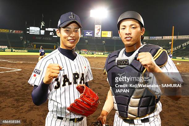 Starting pitcher Shotaro Ueno and Catcher Kengo Horiuchi of Japan pose for a photograph after winning the game between Australia and Japan in the...