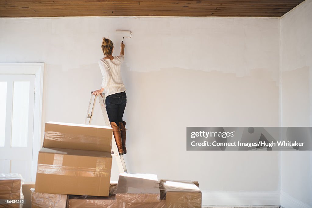 Young woman decorating new home