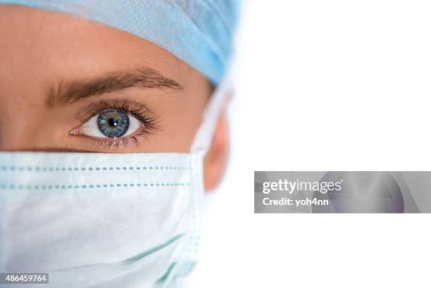 close-up of a female surgeon - protective face mask bildbanksfoton och bilder