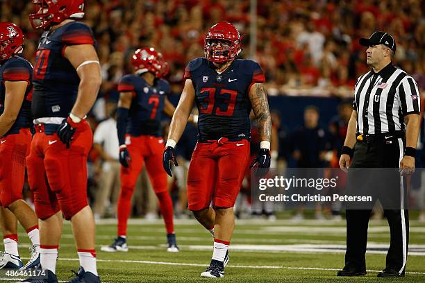 Linebacker Scooby Wright III of the Arizona Wildcats walks on the field during the first quarter of the college football game against the UTSA...