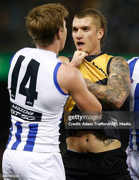 Dustin Martin of the Tigers remonstrates with Trent Dumont of the Kangaroos during the 2015 AFL round 23 match between the Richmond Tigers and the...