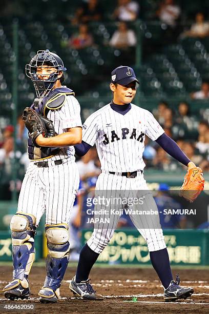 Starting pitcher Shotaro Ueno and Catcher Kengo Horiuchi of Japan celebrate after winning the game between Australia and Japan in the super round...