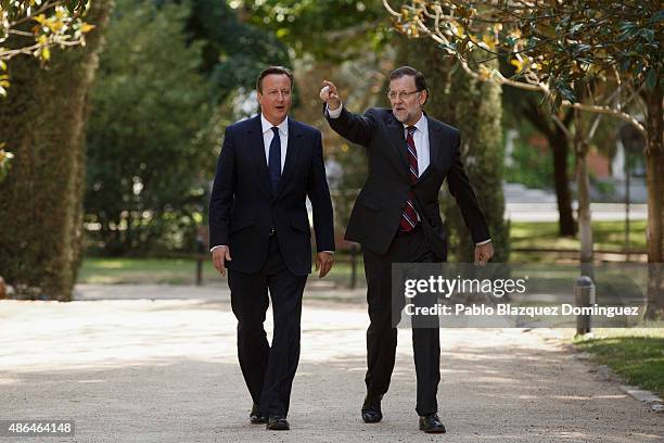 British Prime Minister David Cameron and Spanish Prime Minister Mariano Rajoy chat as they walk at Moncloa Palace on September 4, 2015 in Madrid,...